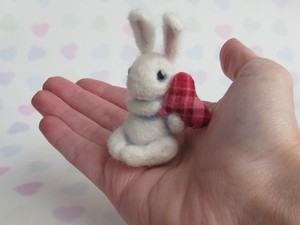Rabbit holding heart