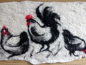 Hens in the snow created using felt
