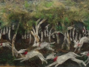 Dogs running in the forest - created using painted wool