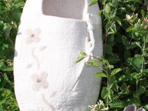 Giant white booties made out of felt