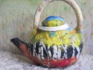 Colourful teapot made out of felt
